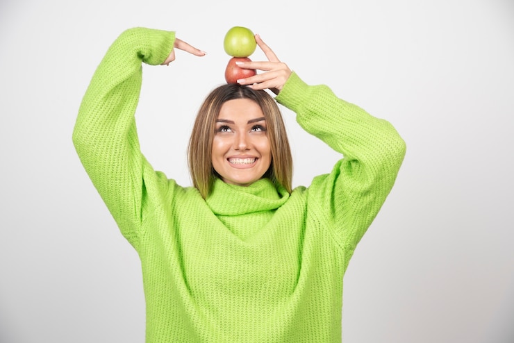 young-woman-green-t-shirt-holding-two-apples-overhead_114579-27409.jpg
